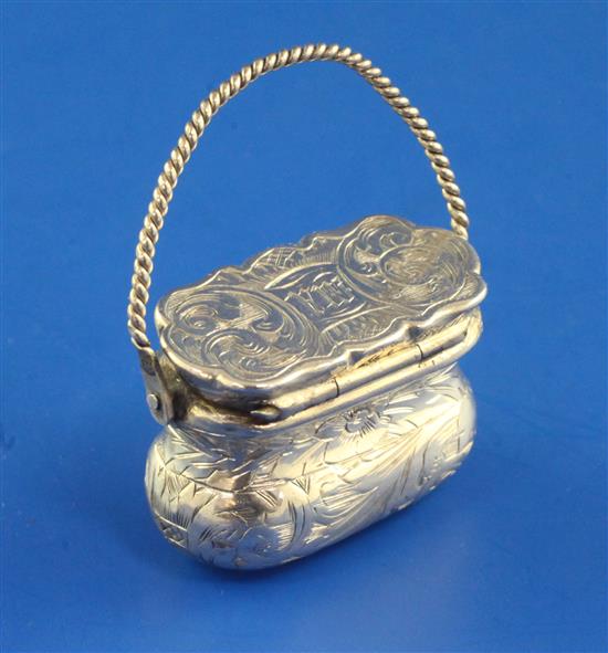 A Victorian silver novelty vinaigrette modelled as a handbag, height 1.75 inc. handle.